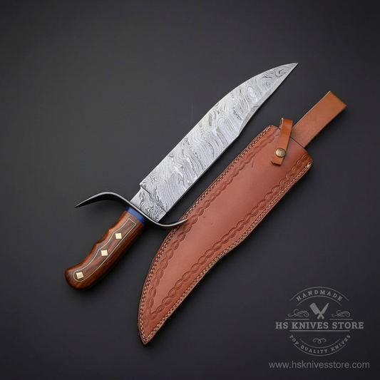Damascus steel Bowie knife rosewood handle diamond brass inlays upswept quillon crossguard tan leather sheath dark charcoal studio mirror