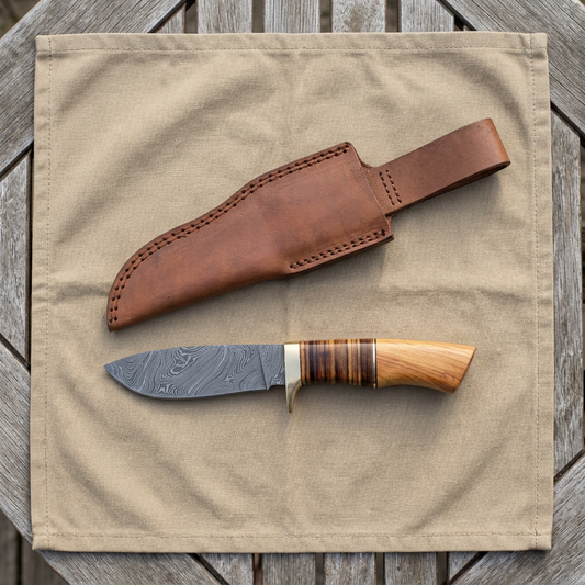 Overhead camping display of 8-inch overall Damascus skinner and sheath