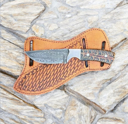 Handmade Damascus skinner knife pinecone resin handle on stone with tooled leather sheath