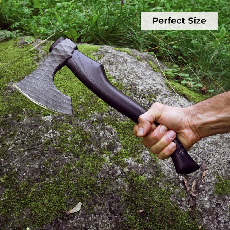 Hand holding a axe with 'Perfect Size' text over a natural background
