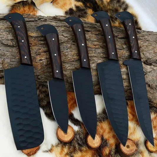 Set of knives with wooden handles and black blades on a fur and wood background