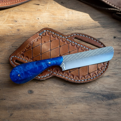 Front view of a Mastercraft Custom Bull Cutter Knife with 4.25-inch Rasp Tool Steel blade and blue epoxy resin handle beside its pancake leather sheath