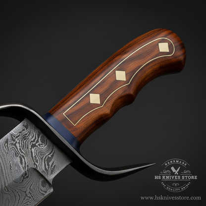 Close-up macro of dark rosewood handle with two diamond brass gold inlay rivets and dark steel curved crossguard with upswept quillon