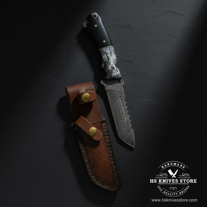 Damascus tanto skinner knife with micarta bone handle and brown leather sheath displayed vertically on dark slate luxury studio background