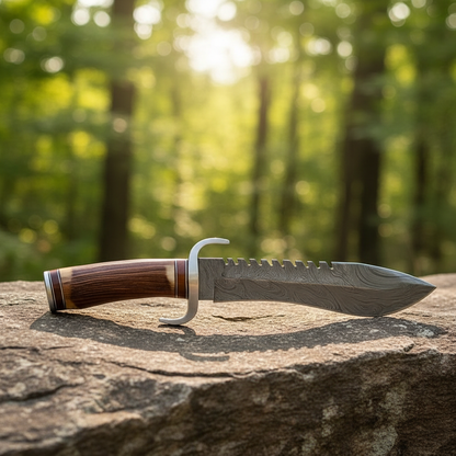 Handmade Damascus Bowie knife antler wood handle on natural rocks outdoors
