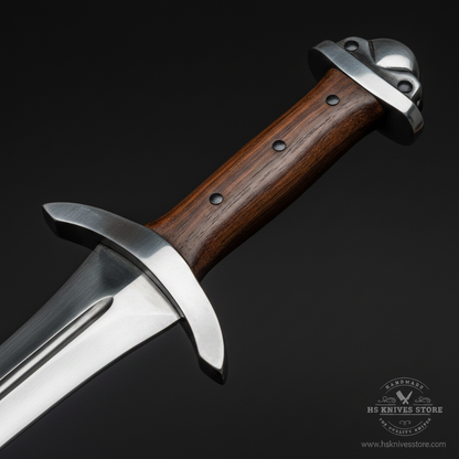 Close-up macro of dark rosewood handle with silver crescent crossguard and steel pommel cap on D2 steel Viking sword