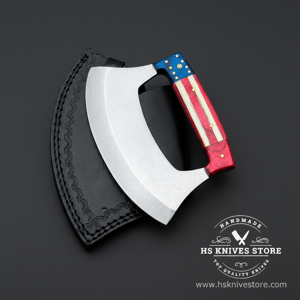 D2 steel ulu knife with American flag handle and black embossed leather sheath on dark charcoal studio background facing right