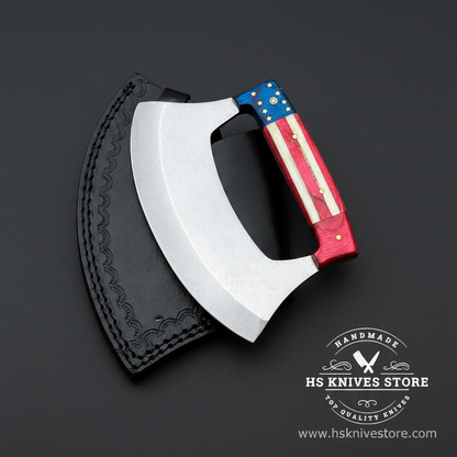 D2 steel ulu knife with American flag handle and black embossed leather sheath on dark charcoal studio background facing right