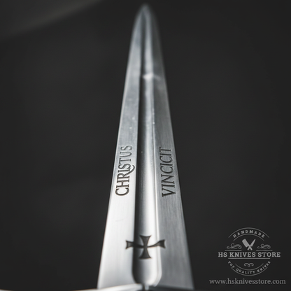 Close-up macro of Knights Templar Accolade sword blade showing CHRISTUS VINCIT Latin engraving and Templar cross etching detail