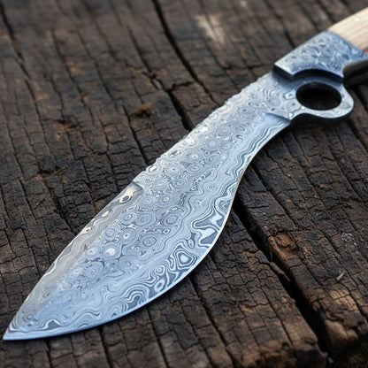 close-up of a Damascus steel knife with a wavy, patterned blade and a light-colored wooden handle, resting on a rustic, weathered dark wood surface.