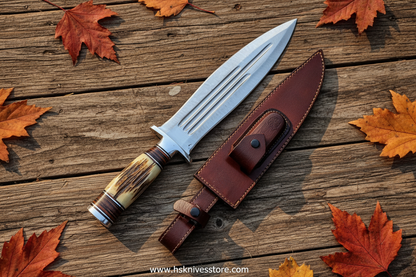 Handmade Bowie knife with leather sheath flat lay on rustic wood with leaves www.hsknivesstore.com