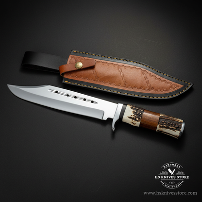 D2 steel Bowie knife with stag horn wood handle and two-tone leather sheath mirror view on dark charcoal background