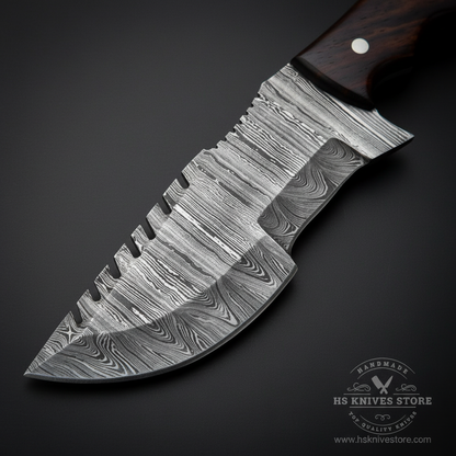 A close-up of a fixed-blade knife with a patterned Damascus steel blade and a dark wood handle, shown on a dark background with an HS Knives Store watermark.