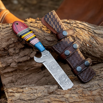 Handmade Damascus steel cowboy bull cutter hunting knife with resin handle in a western ranch setting