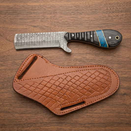 Front view of Damascus Cowboy Bull Cutter knife with dark Pakka Wood handle and tan cowhide pancake sheath