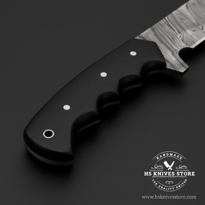 Macro close-up of black micarta Kukri knife handle showing three finger groove scallops two steel pins round pommel and steel ring