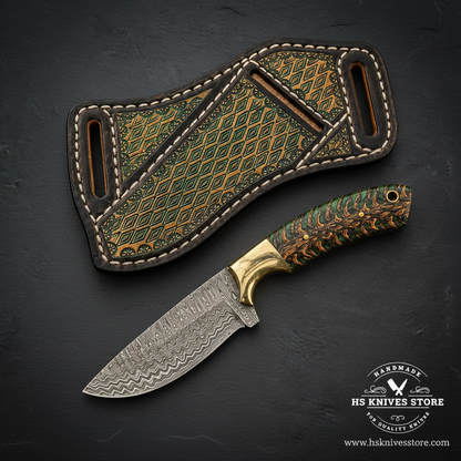 Green pinecone Damascus Skinner Knife and diamond-stamped scout sheath on dark slate