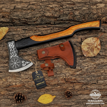Viking Norse tomahawk axe flat lay with ash wood handle and HS Knives Store hang tag on rustic wood with autumn leaves