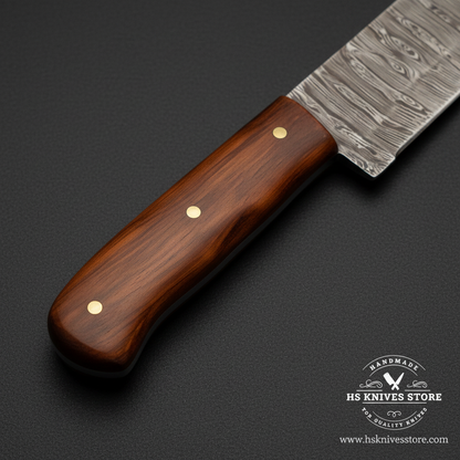 Close-up of the natural rosewood handle with three brass pins and full-tang blade connection