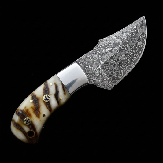 Damascus fixed blade skinner knife ram horn handle steel bolster studio shot dark background