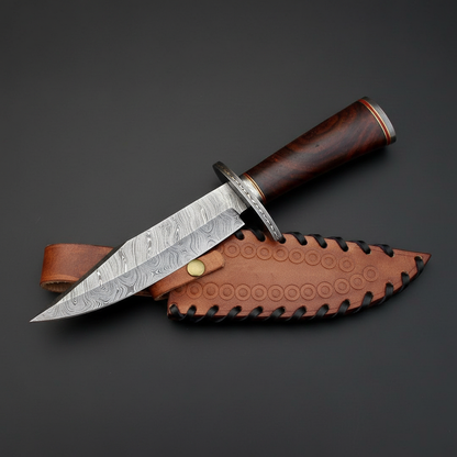 Handmade Damascus Bowie knife with rosewood handle and black steel bolster, dark charcoal studio background right facing