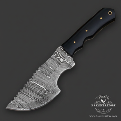Close-up of the twist Damascus pattern and spine filework on a tracker hunting knife blade