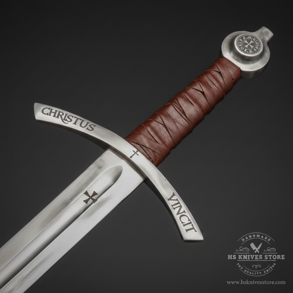 Close-up macro of Knights Templar Accolade sword handle showing brown leather diamond wrap grip silver medallion pommel and curved crossguard