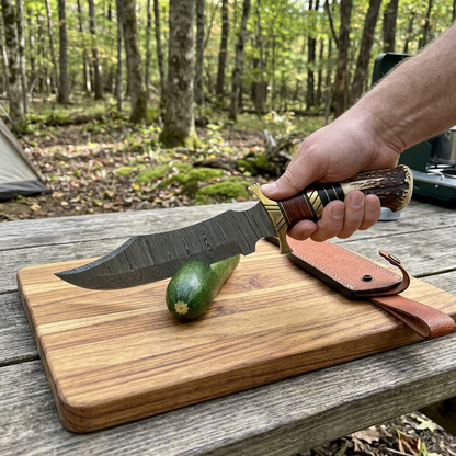 Campsite action view of Damascus Bowie preparing zucchini on a stable board