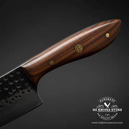 Macro view of dark walnut wood handle with brass mosaic pin and brass pin on carbon steel chef knife