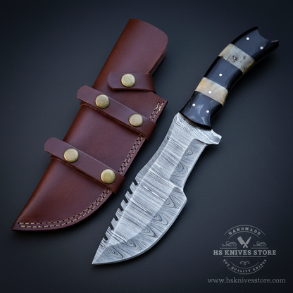 Damascus steel tracker knife two-tone camel bone buffalo horn handle dark burgundy leather multi-pocket sheath dark charcoal studio