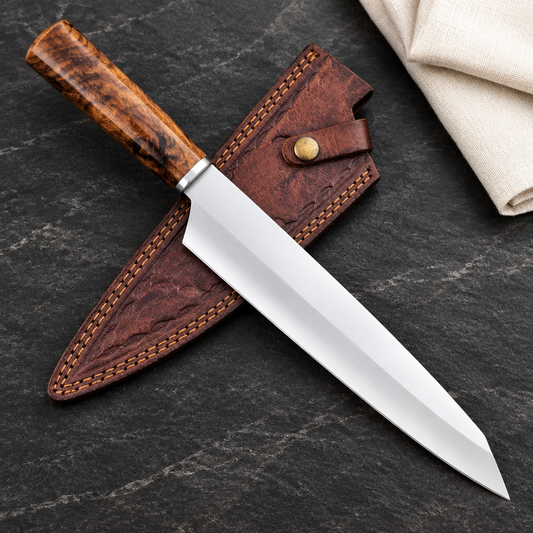 Reverse view of wood-handled D2 chef knife and stitched leather sheath on charcoal stone
