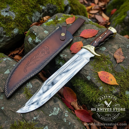 D2 steel Bowie knife dark rosewood handle resting on mossy rocks in outdoor forest setting with dark brown floral leather sheath