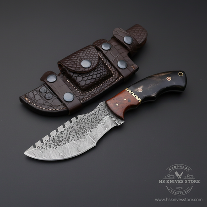 Damascus steel tracker knife buffalo horn rosewood handle crocodile leather sheath dark charcoal studio background mirror