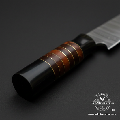 Macro view of three-section buffalo horn and wood spacer ring handle on Damascus chef knife