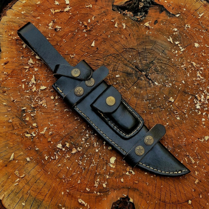 Black leather sheath close-up with contrasting stitching and decorative snaps