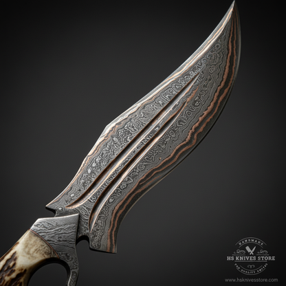 Close-up macro of Damascus copper Bowie blade showing bold flowing wave Damascus pattern with copper highlights and dual fuller grooves