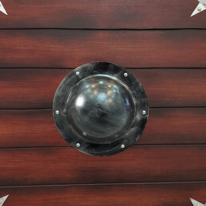 Close-up of raised center boss and wood plank face on a handmade Viking round shield