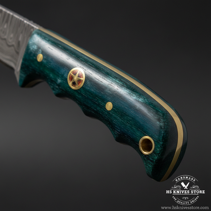 Macro close-up of dark teal dyed camel bone knife handle showing smooth finish and brass star concho pin detail