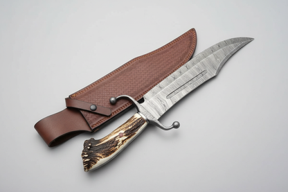Handmade Damascus Bowie knife with stag crown handle bright clean product photography light grey background