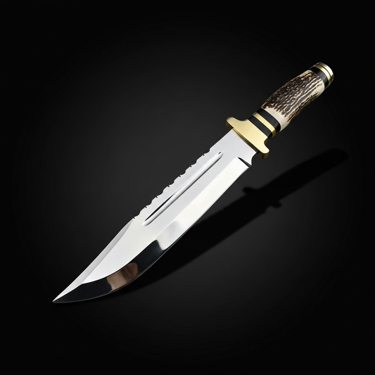 Handmade D2 steel Bowie knife with mirror polished blade and stag antler handle on black studio background left facing