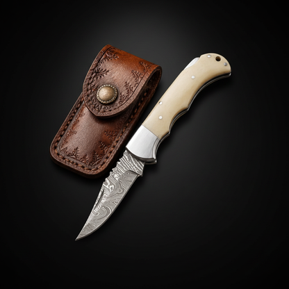 Damascus folding pocket knife white bone handle black background with leather sheath studio shot