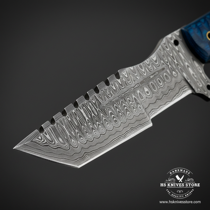 Macro close-up of Damascus steel tracker knife blade showing bold wavy flowing Damascus pattern and spine jimping on dark charcoal background