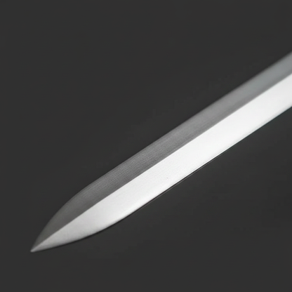 Fantasy sword blade tip macro showing sharp double edges and polished silver finish close-up