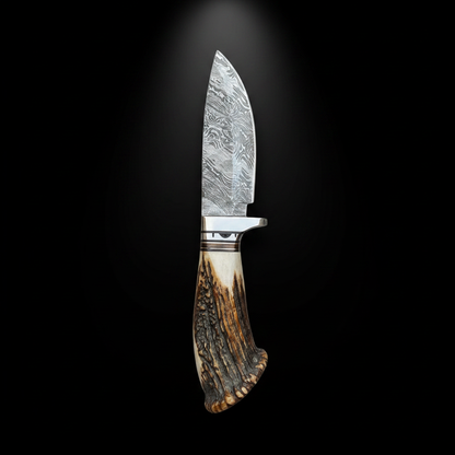 Damascus skinner knife antler crown handle black background no sheath