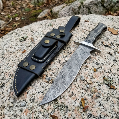 Left-angle outdoor display of wood-handle Damascus Bowie