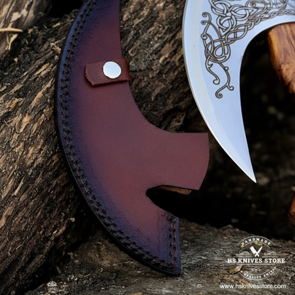 Close-up macro of dark burgundy leather sheath with snap button and black stitching for Viking pizza axe