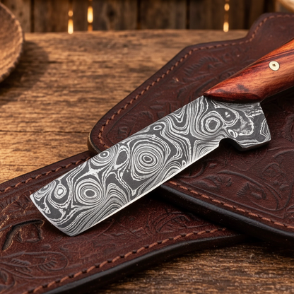 Close-up of the patterned 3.5-inch Damascus steel blade on a Bull Cutter Knife