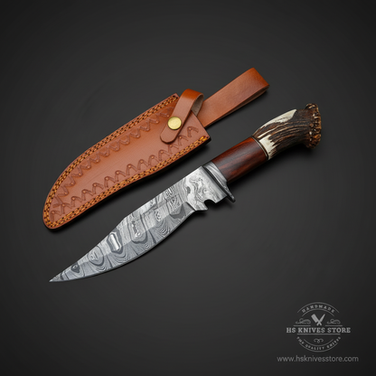 Damascus steel Bowie knife stag crown rosewood handle Damascus bolster tan tooled leather sheath dark charcoal studio right