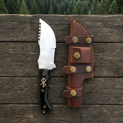 Outdoor woodland display of handmade micarta-handled tracker knife and sheath