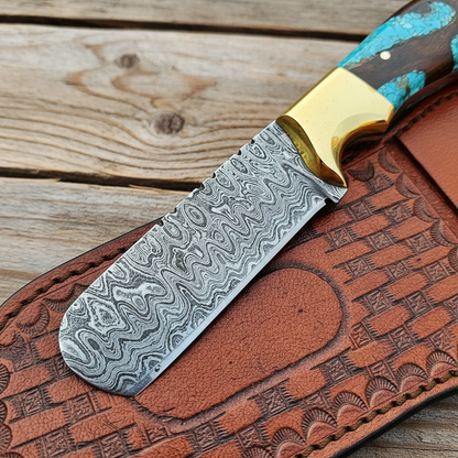 Close-up of the flowing Damascus pattern on a handmade bull cutter knife blade